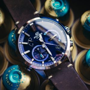 silver and blue round chronograph watch