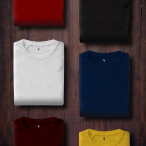 assorted color folded shirts on wooden panel